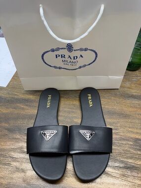 Prada Black Leather Logo Slide Sandals with Silver Plaque